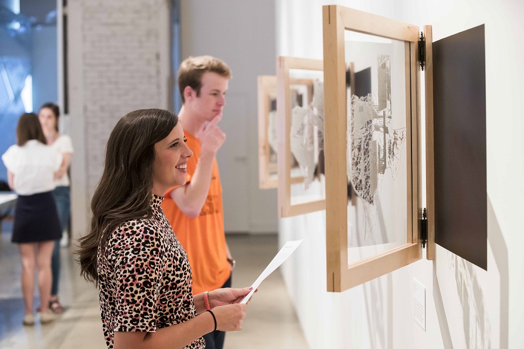 Students enjoy pictures on display at the Museum of Art.